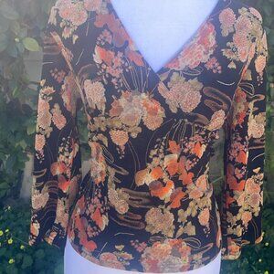 Orange and black floral blouse with a boho vibe